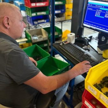 Exactech employee entering data for Implant Box Inventory COC